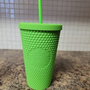 Lime green 16 oz Starbucks cup.